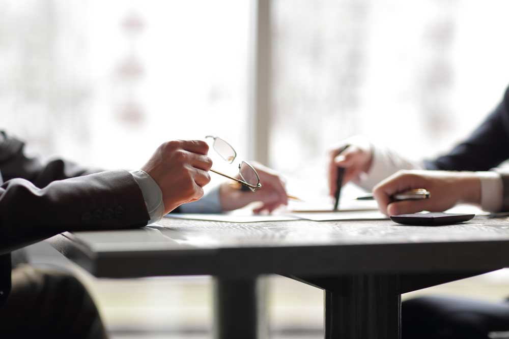 Two people speaking in a Baywulf Consulting Coaching Session 